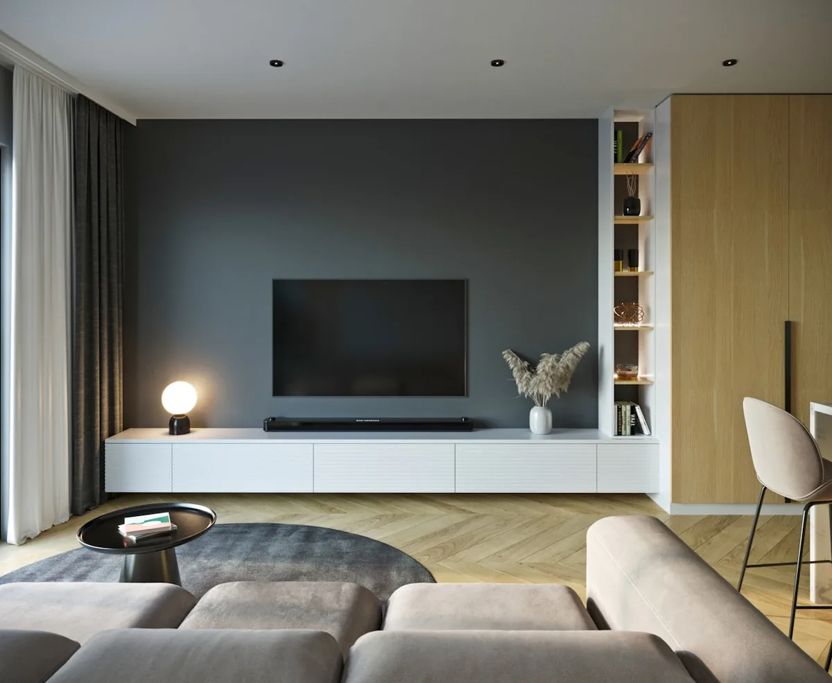 Sala com TV como alternativa ao projetor gamer Sala de estar moderna com TV grande sobre rack branco, soundbar e iluminação ambiente aconchegante
