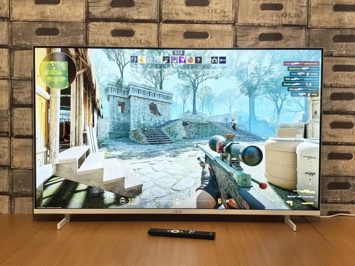 TCL C755 Review 2026 — TV para Games QD-Mini LED TCL C755 TV QD-Mini LED 4K 65 polegadas em sala de jogos com PS5 e Xbox